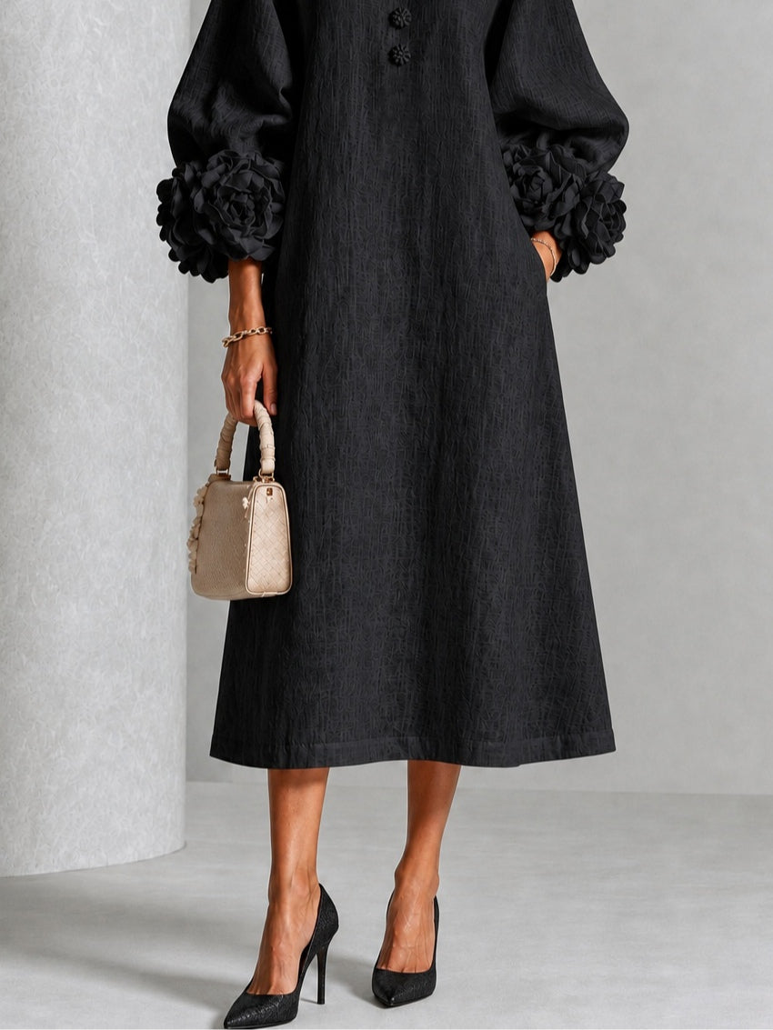 Vestido midi negro con botones y puños de flores