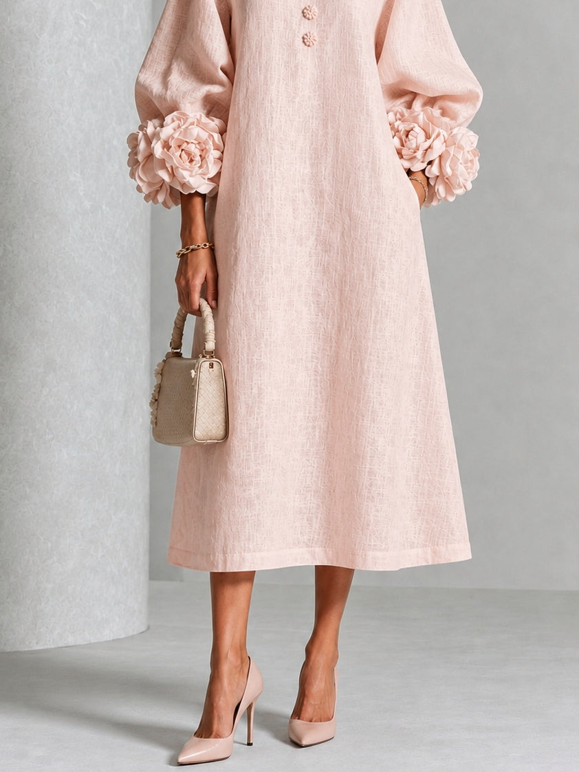 Vestido midi rosa con botones y puños de flores