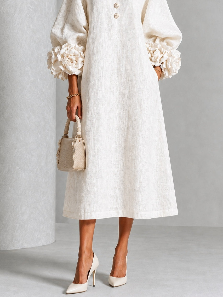 Vestido midi blanco con botones y puños de flores