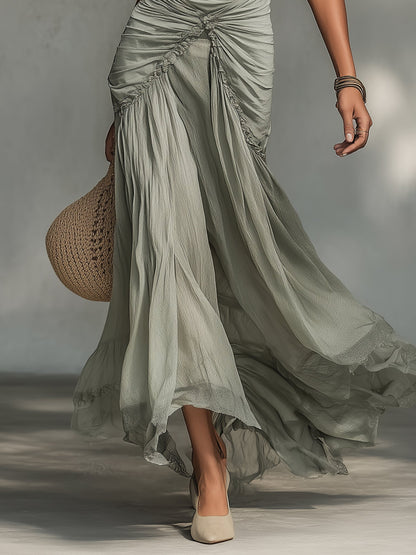 Vestido largo gris de tejido elástico y gasa