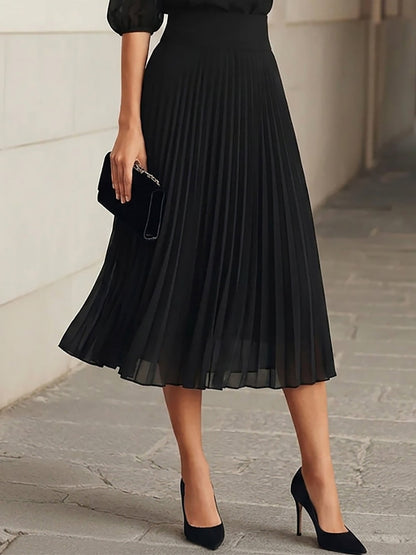 Conjunto de tres piezas: top de gasa y falda midi plisada en negro