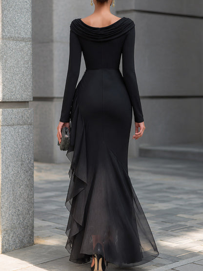 Vestido largo negro corte sirena con escote drapeado y hombros descubiertos