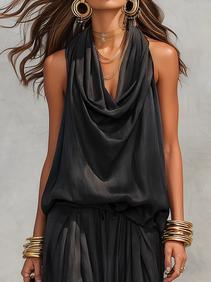 Conjunto de top halter y pantalón plisado en negro