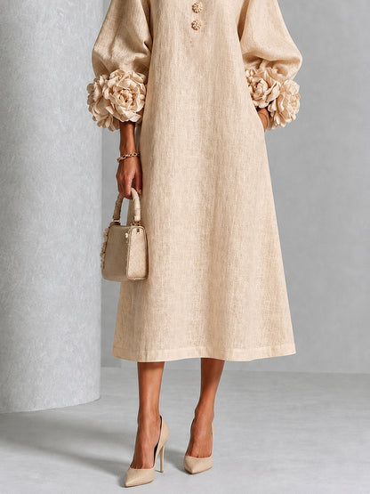 Vestido midi beige con botones y puños de flores