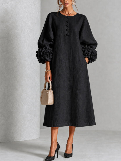 Vestido midi negro con botones y puños de flores