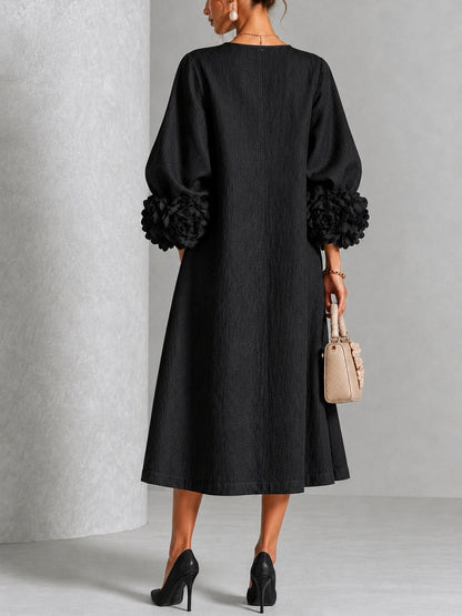 Vestido midi negro con botones y puños de flores