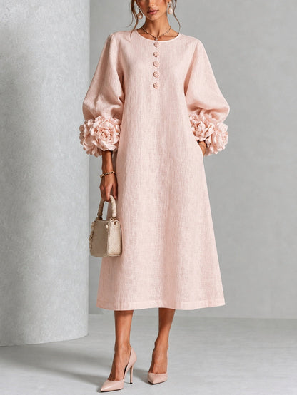 Vestido midi rosa con botones y puños de flores