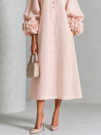 Vestido midi rosa con botones y puños de flores