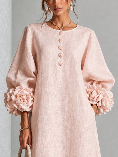 Vestido midi rosa con botones y puños de flores