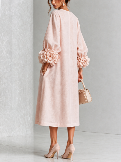 Vestido midi rosa con botones y puños de flores