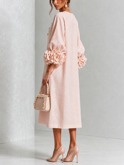 Vestido midi rosa con botones y puños de flores