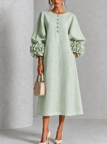 Vestido midi verde salvia con botones y puños de flores