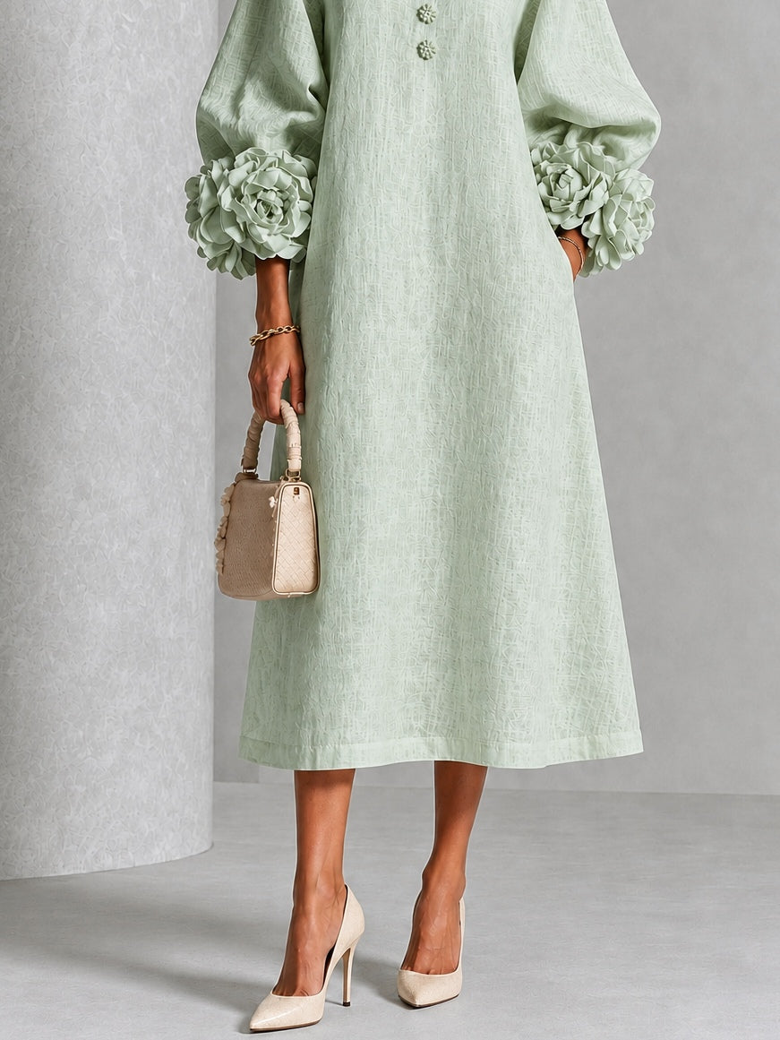 Vestido midi verde salvia con botones y puños de flores