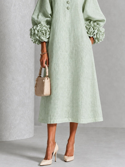 Vestido midi verde salvia con botones y puños de flores