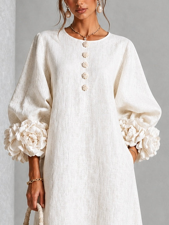 Vestido midi blanco con botones y puños de flores